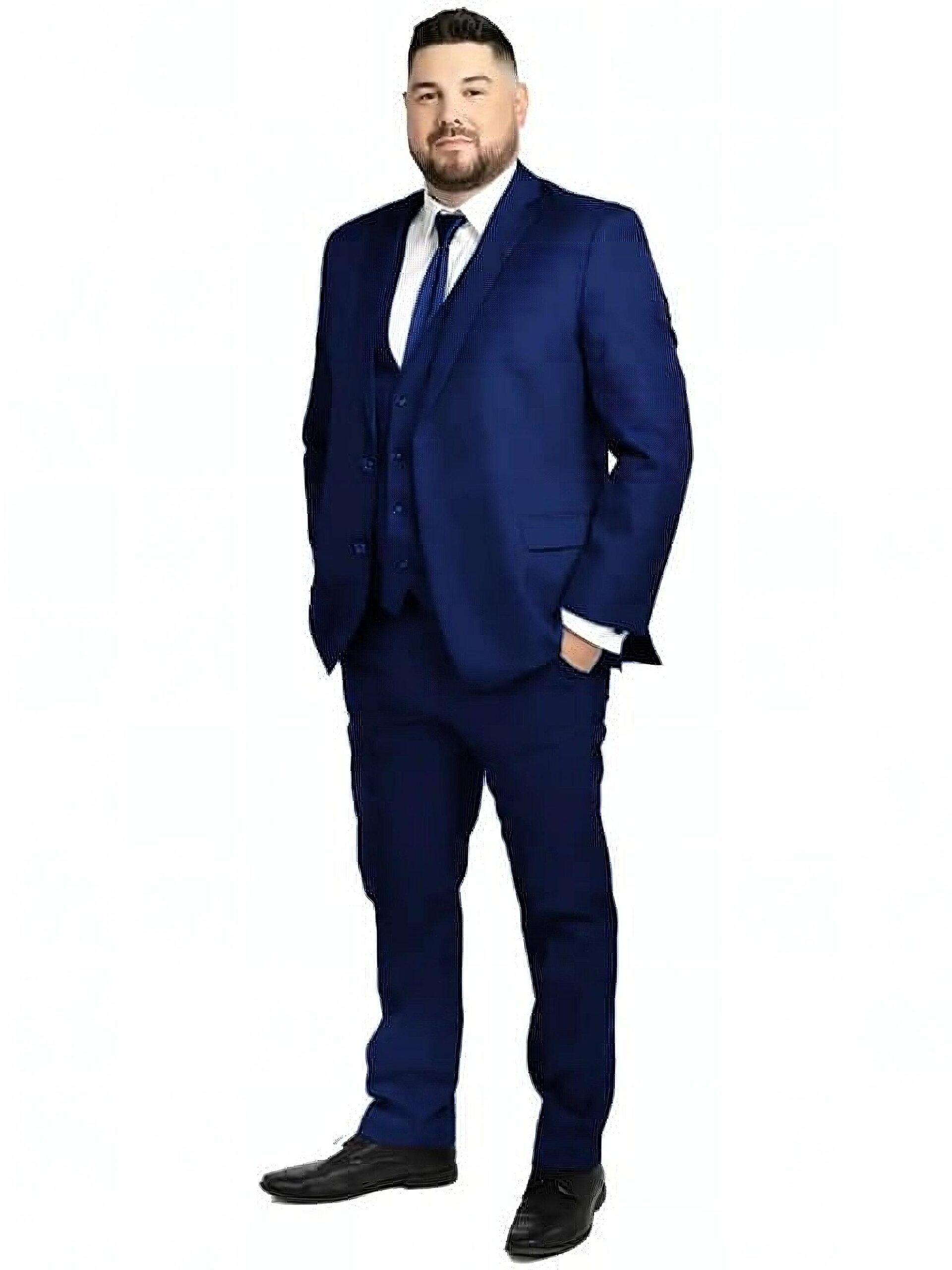 Man in a navy business suit with white shirt and tie, standing with hands in pockets against a white background.