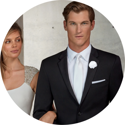 Man wear a black tux with a long white bow tie, white pocket square with Bride